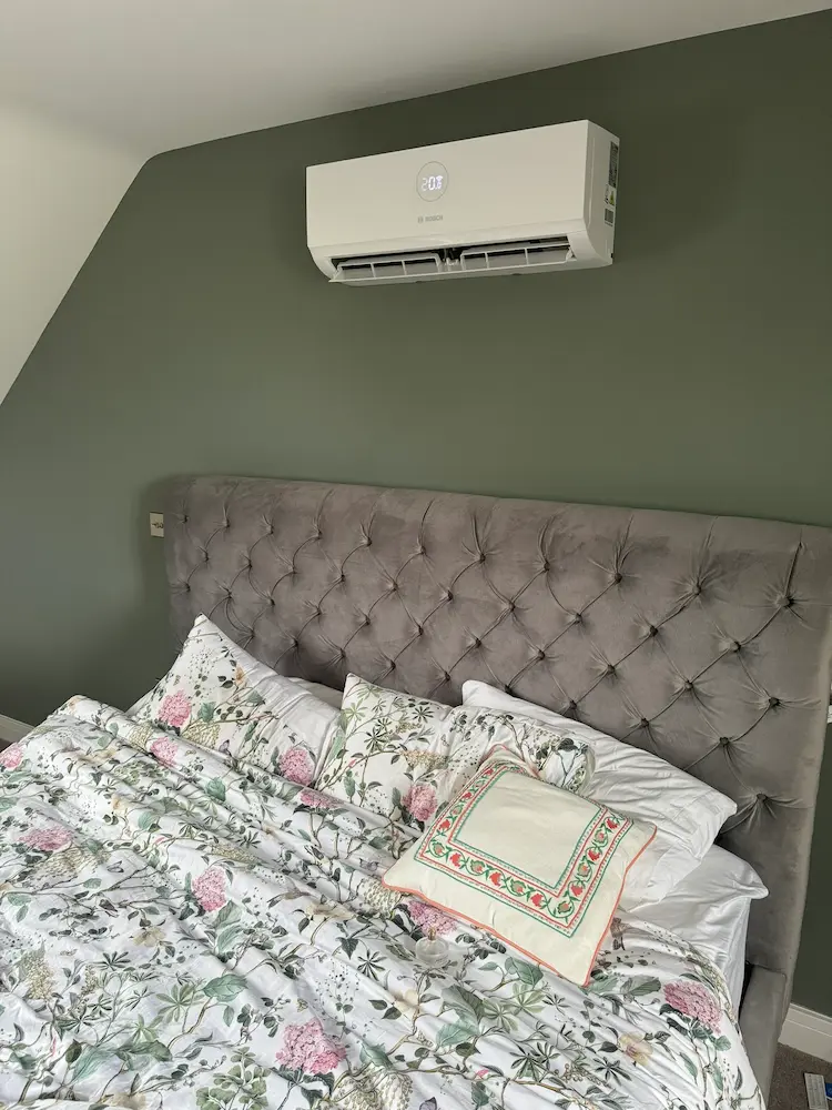 Wall mounted air conditioning indoor unit being installed